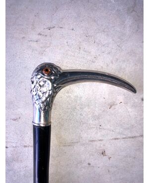 Stick with silver handle depicting an Ibis bird, ebony barrel.     