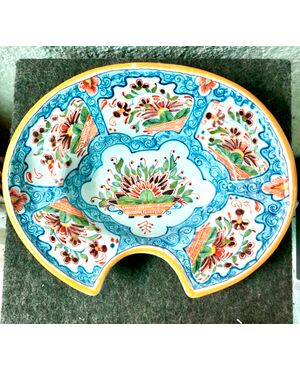 Shaving plate decorated with flower baskets within medallions and stylized plant motifs, Delft Manufactory, Holland.     