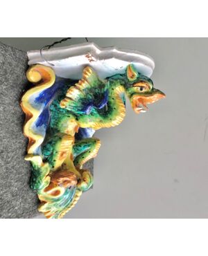 Majolica shelf with support in the shape of a winged dragon.Imola manufacture.     