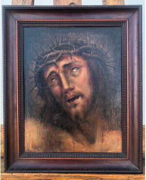 Oil painting on canvas depicting the face of Christ with crown of thorns.     