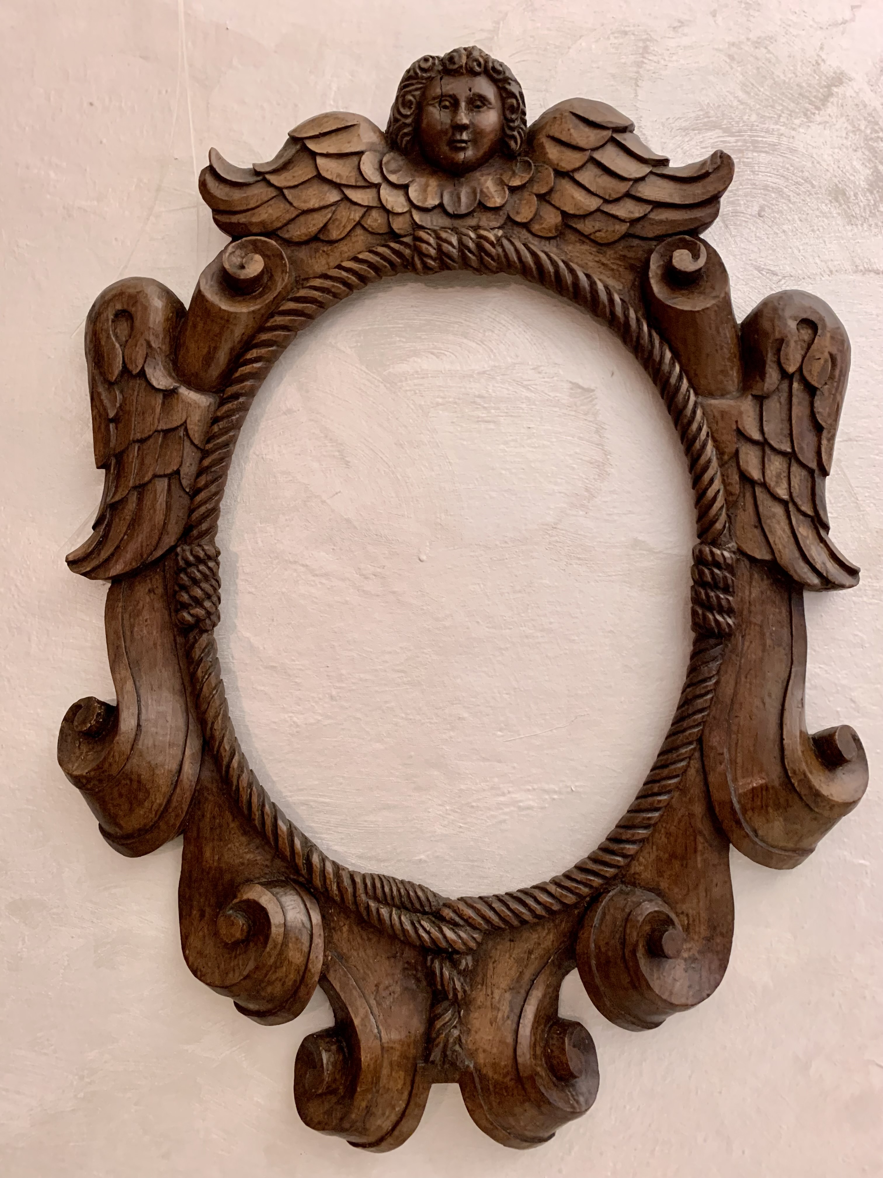 Antica cornice ovale in legno