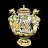 Vaso in maiolica con coperchio e due manici a forma di draghi.Decoro a personaggi e architetture sullo stile Castelli.Manifattura di Angelo Minghetti.Bologna.