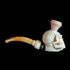 Pipa in schiuma di mare raffigurante mano che regge un teschio con scatola originale.Francia.