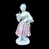 Scultura a in porcellana raffigurante contadina con falcetto.Meissen Germania.
