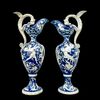 Coppia di vasi in maiolica con manici a forma di drago e decoro a raffaellesche su sfondo blu.Manifattura Molaroni.Pesaro.