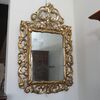 Specchiera rettangolare finemente intagliata in legno dorato
