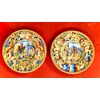 Pair of majolica plates with historiated decoration with scene description on the reverse.Molaroni manufacture, Pesaro.     