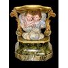 Base di statua in legno intagliato e dipinto. Parte frontale con coppia di putti e motivi laterali rocaille.Liguria.