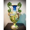 Majolica vase with snakes and masks side intakes and historiated decoration.Minghetti Manufacturing.Bologna.     