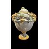 Vaso in maiolica con motivo a tralci d’una in rilievo,prese a forma di testa di ariete e coperchio con presa a forma di limone.manifattura Dallari,Sassuolo. 