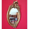 Oval mirror with cymatium