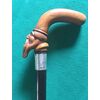 Bastone da passeggio con pomolo raffigurante figura maschile con barba in legno di bosso,ghiera in argento e canna in palissandro.