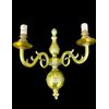 Lampada applique in bronzo pieno a due fuochi.