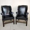 Coppia di poltrone inglese bergere in pelle nera del XX secolo 