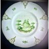 Piatto in maiolica in monocromia verde con motivi rocaille sulla tesa e scena galante nel cavetto.Manifattura di Angelo Minghetti,Bologna.