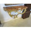 golden console with wooden floor marbled
