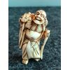 Netsuke &#39;in ivory depicting demon with frog.Japan     