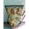 Terracotta shelf depicting Angel with ribbon.Italy     
