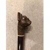 Bastone portaguanti con pomolo raffigurante cane con bocca apribile con pulsante.
