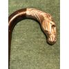 Stick with silver knob depicting horse&#39;s head.     