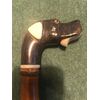Bastone portaguanti con pomolo in corno raffigurante testa di cane con meccanismo per aprire la bocca.Canna in bambu'.