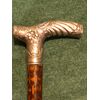Stick with silver knob decorated with floral and rococo motifs. Italy.     
