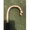 Bastone con impugnatura in argento con testa di cane.