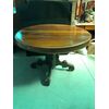 Round walnut table with central leg and four feet. Luigi Filippo period.     
