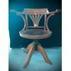 Height-adjustable light wood chair.     