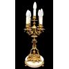 Lampada da tavolo in bronzo dorato a cinque fuochi.