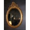 Specchiera ovale orizzontale francese del 1800 stile Luigi XV dorata foglia oro