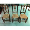 Three blond walnut chairs with straw covered seat.     