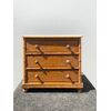 Model of sweet wood chest of drawers with bamboo details and marble top.     