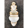 Acquasantiera in porcellana bianca e oro con tritoni,putto e simbolo Bernardiniano.Italia.