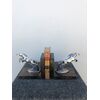 Coppia di fermalibri in metallo e legno raffiguranti cavalli stile art-d’eco’.