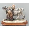 Figura di contadina con mucca in ceramica.Manifattura Cacciapuoti. Milano.