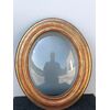 Carved wooden frame with leaf and gold leaf motifs. Domed glass. Louis Philippe period.     