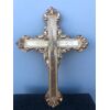 Cross in carved and gilded wood with stylized plant motifs.     