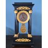 Orologio Impero in bronzo dorato e legno ebanizzato