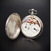 Orologio con doppio fuso orario e quadrante dipinto Firmato "Meuron", XVIII secolo 