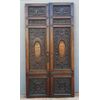 PTI754 - Porta in noce, due battenti scolpiti con mascheroni e decori fogliacei, epoca '800, misure cm L 106 x H 211