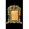 Cornice in bronzo con angeli,motivi neoclassici e arpie.