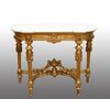 Antique Napoleon III console table in gilded and carved wood with a white marble top. France, 19th century.