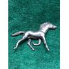 A silver sculpture depicting a small trotting horse Italy.     