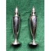 Pair of silver sugar spreaders with engraved floral motifs. Sterling punch. Use.     