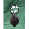 Magnifying glass in dark horn.     