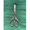 Metal midwife scissors for metal umbilical cord decorated with stylized stork.     