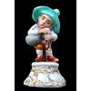 Porcelain hunchback figure playing bagpipes. Fabris manufacture. Milan.