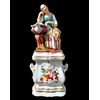 Figurative porcelain veilleuse with lady and floral decoration. France