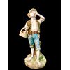 Polychrome majolica sculpture depicting a peasant drinking eggs. Ginori.